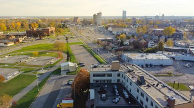 Top view Main Street in City of Niagara Falls with high-rise buildings hotels and Canadian border, Ontario downtown in background. Small town USA in Upstate New York, America