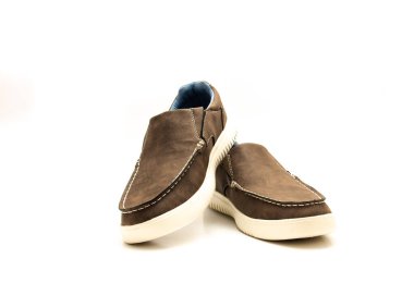 Top view brand new pair of brown double gore slip on shoe for men with memory foam insole isolated on white background. Lightweight polyester lining casual stylish footwear accessories