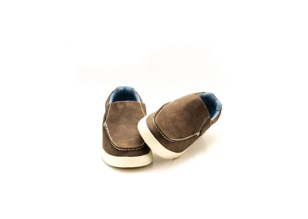 Front view brand new pair of brown double gore slip on shoe for men with memory foam insole isolated on white background. Lightweight polyester lining casual stylish footwear accessories