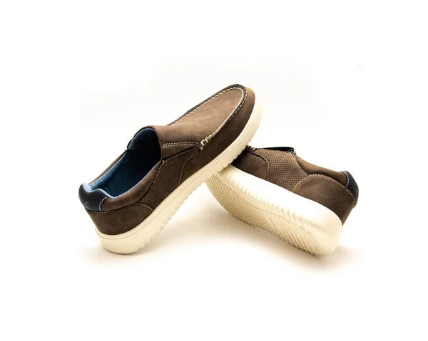 Top view brand new pair of brown double gore slip on shoe for men with memory foam insole isolated on white background. Lightweight polyester lining casual stylish footwear accessories