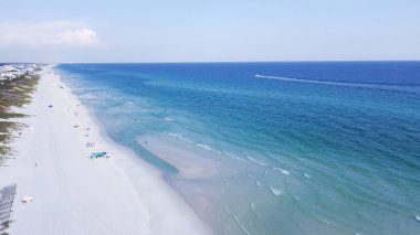 Miles of untouched beaches brilliantly white sand, crystal clear turquoise water with gorgeous shade of blue along upscale residential waterfront neighborhood in Santa Rosa, Florida, USA. Aerial view clipart