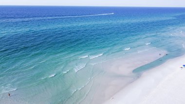 Aerial view brilliantly white sandy shore with crystal-clear turquoise water and gorgeous shade of blue waves along miles of untouched beaches Santa Rosa, Walton County, Florida, USA. Emerald Coast clipart
