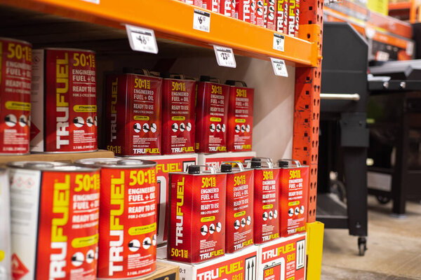 DALLAS, TX-MAR 2, 2024: 2.1 gal mixed steel container TruFuel ethanol-free premixed fuel, synthetic lubricants, stabilizers for 2, 4-cycle power equipment on shelves, price tags, Home Depot store. USA