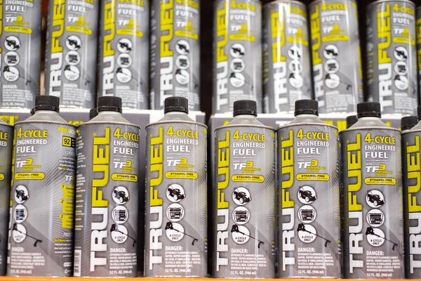 DALLAS, TX-MAR 2, 2024:32oz grey steel container TruFuel engineered premixed fuel with synthetic lubricants, stabilizers for 4-cycle power equipment on shelves with price tags at Home Depot store. USA