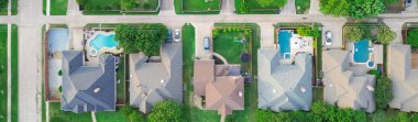Panorama view upscale single-family homes with swimming pool and large backyard in expensive residential neighborhood suburbs Dallas, Texas, straight aerial view detached houses, quite street. USA clipart