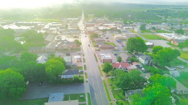 Aerial view Checotah city in McIntosh County, Oklahoma nestled among intersection of interstate I-40, US highway 69, small town with red brick buildings, antique malls, quiet street early morning. USA clipart