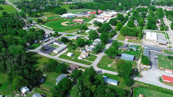 stock image Aerial view high school baseball field with farm houses, large farmland in Fairland agriculture town, U.S. Highway 60, State Highway 125, Ottawa County, Oklahoma, business and residences building. USA