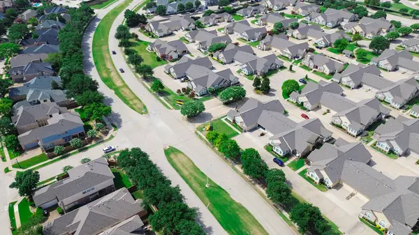 stock image Upscale residential house with swimming pool near gated community for active senior adults in expensive West Plano, Texas, premier condominium duplex maintenance-free lifestyle, aerial view. USA