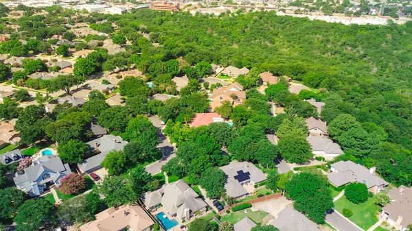 stock image Large urban forest greenbelt outside master planned sustainable neighborhood mixed residential houses and apartment complex suburbs Dallas Fort Worth metroplex, environmentally friendly, aerial. USA