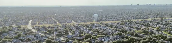 stock image Panorama aerial view high density subdivision row of suburban houses along Coit Road downtown Plano Texas background, upscale homes swimming pool in Wentworth Estates, River Bend neighborhood. USA