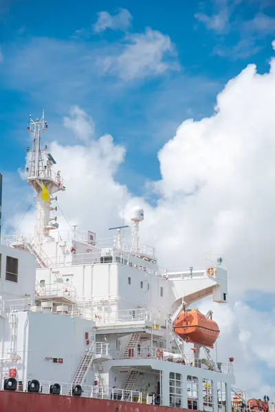 stock image Close-up bridge deck, crane, lifeboat VHF radio frequencies antennas satellite signals navigation radar on large crude oil tanker bulk transport sail thru South Padre Island, Brownsville port, TX. USA