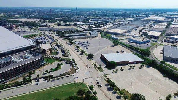 stock image Industrial warehouse space near entertainment district in manufacturing zoning South of Arlington, Texas, rapidly developing supply chain hub logistics in established business community, aerial. USA