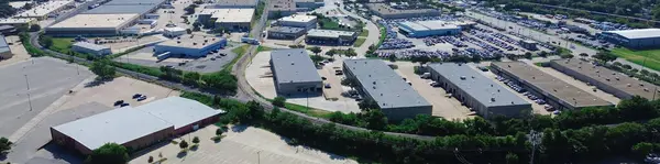 stock image Panorama aerial view dense warehouse space, fulfilment center in industrial manufacturing zone South of Arlington, Texas along East Division Street, freight railroad, supply chain hub logistic. USA