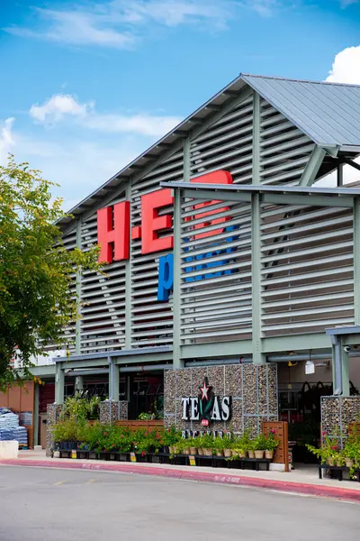 stock image SCHERTZ, TX, US-JUL 25, 2024:Close-up facade entrance of H.E.B Plus grocery store under sunny cloud blue sky, San Antonio based private supermarket chain more than 380 stores in the USA and Mexico