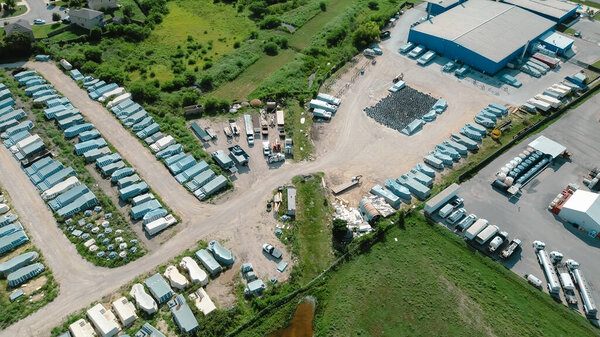 Row of prefab fiberglass swimming pool at large manufacturer factory yard, New Braunfels, Texas, versatile inground wide selection of style, design, price ready for backyard installation, aerial. USA