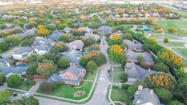 Cul-de-sac keyhole shape street in park side upscale residential neighborhood spacious two-story houses swimming pool, large backyard along McKamy Trail, Shady Brook Trail in Plano, Texas, aerial. USA clipart