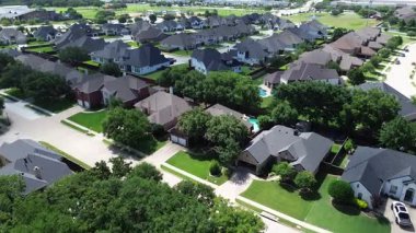 Established and new construction homes with spacious fenced backyard, resort style swimming pool, patio furniture, open lawn space for family recreation, outdoor relaxation in Flower Mound, Texas