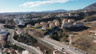 A housing estate located on a beautiful mountain. City of Fuengirola, Spain, Aerial 4k video
