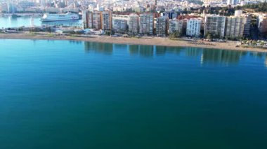 Malaga Drone Footage Aerial Flight Shot Of beach, mountain and buildings