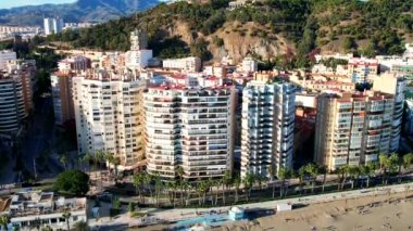 Malaga Drone Footage Aerial Flight Shot Of beach, mountain and buildings