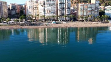Malaga Drone Footage Aerial Flight Shot Of beach, mountain and buildings