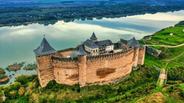 Khotyn fortress on the bank of the river. A wonderful autumn landscape. clipart