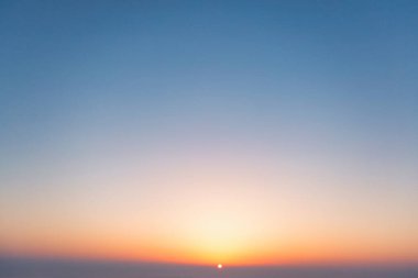 A wonderful bright dawn, above the clouds. Drone flight over the dawn.