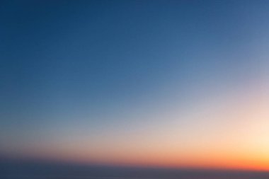 A wonderful bright dawn, above the clouds. Drone flight over the dawn.