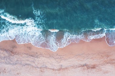 Beach view from a drone. A wonderful summer landscape, clean sand and blue water. A great place to relax.