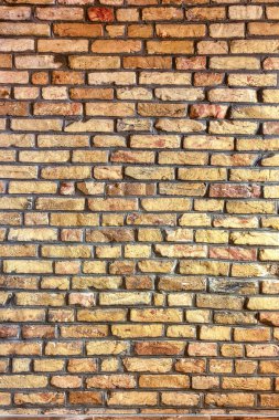 A brick wall, made of treated, antique-styled brick. High quality abstract background or texture.