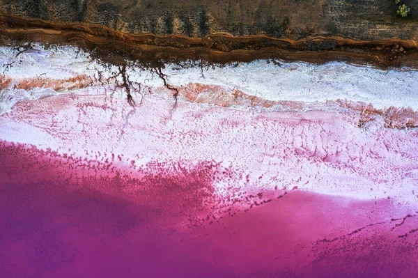 Top view of the salt-covered shore of Pink Lake. Drone view