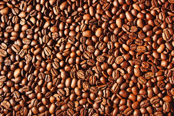 Food texture, high-quality coffee beans, roasted natural coffee. Abstract background.