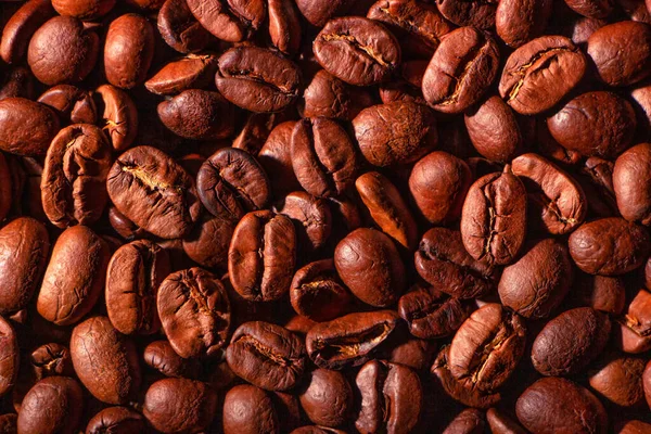 Food texture, high-quality coffee beans, roasted natural coffee. Abstract background.
