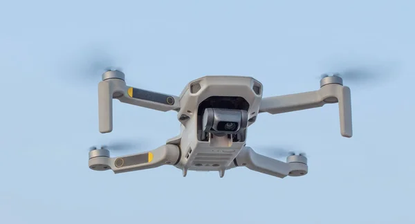 Quadcopter with a high-quality camera on the background of the sky