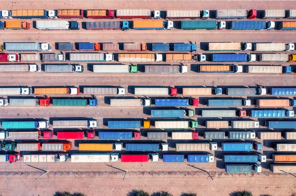 stock image This photo highlights the enormous size and capacity of Ukraine's grain transportation industry, with a formidable queue of trucks awaiting their turn to unload at the bustling port