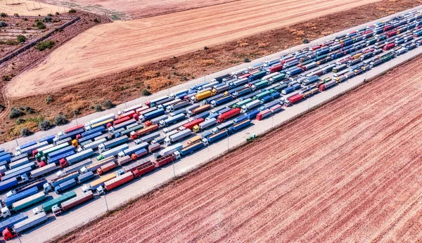 Ukraine's role as a major grain exporter, with a huge line of trucks transporting grain near the port