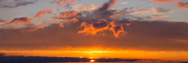 Horizon\'s Embrace: Sunset Panorama Painting the Sky