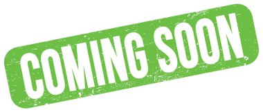 COMING SOON text written on green grungy stamp sign.