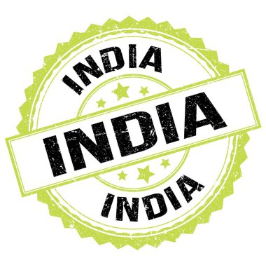 INDIA metni yeşil-siyah pul işareti üzerine yazılmış