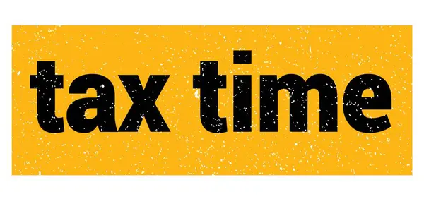 税务时间文字写在黄黑相间的图章上 — 图库照片