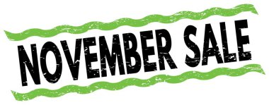 Yeşil-siyah çizgi işareti üzerine yazılmış Kasım Satışı metni.