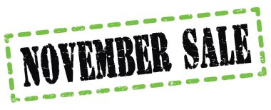 Yeşil-siyah pano işareti üzerine yazılmış Kasım Satışı metni.