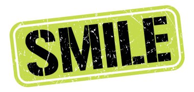 SMILE text written on green-black grungy stamp sign.