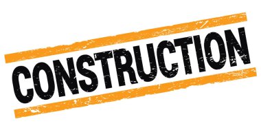 Siyah-turuncu dikdörtgen mühür işareti üzerine yazılmış KONSTRUCTION metni.