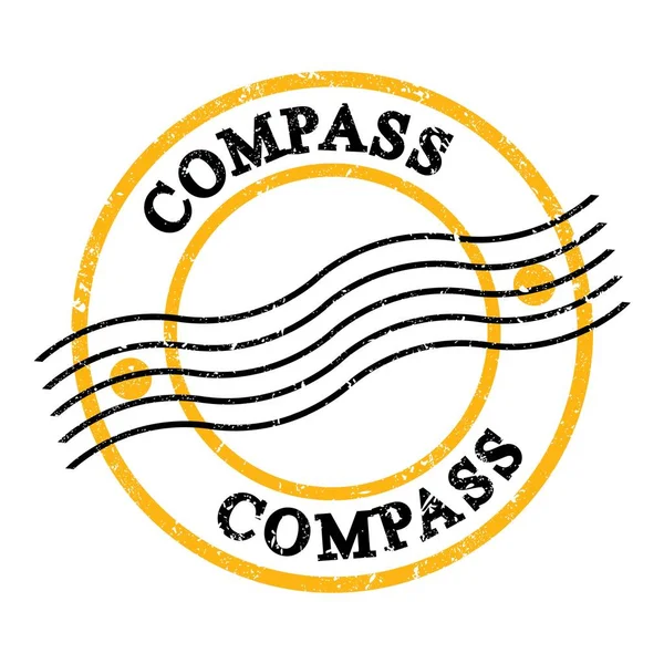 COMPASS, sarı-siyah grungy posta pulu üzerine yazılmış metin.