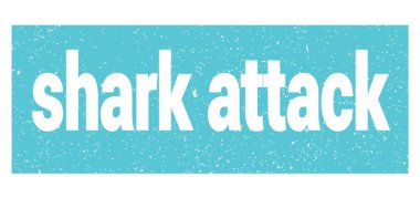 shark attack text written on blue grungy stamp sign.