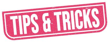 Pembe grungy işareti üzerine yazılmış TIPS & TRICKS metni.