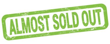 Yeşil dikdörtgen mühür işareti üzerinde neredeyse satılmış metin.