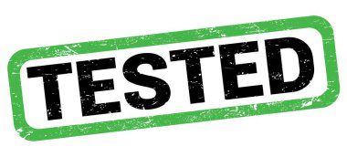 Yeşil-siyah dikdörtgen mühür işareti üzerine yazılmış TESTED metni.
