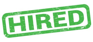 Yeşil dikdörtgen damga işareti üzerine yazılmış HIRED metni.